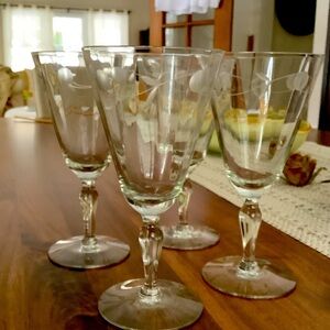 Elegant set of four etched stemmed wine glasses
